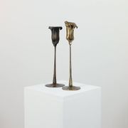 Pair of vintage brass candle holders with tulip decoration.