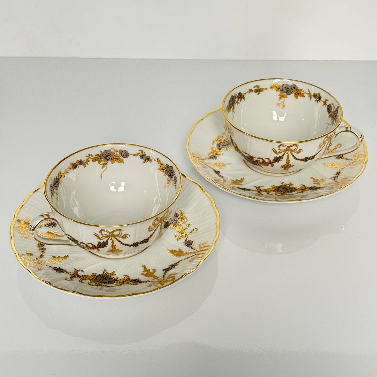 6 Bernardaud teacups and saucers | ribbons/bows and garlands