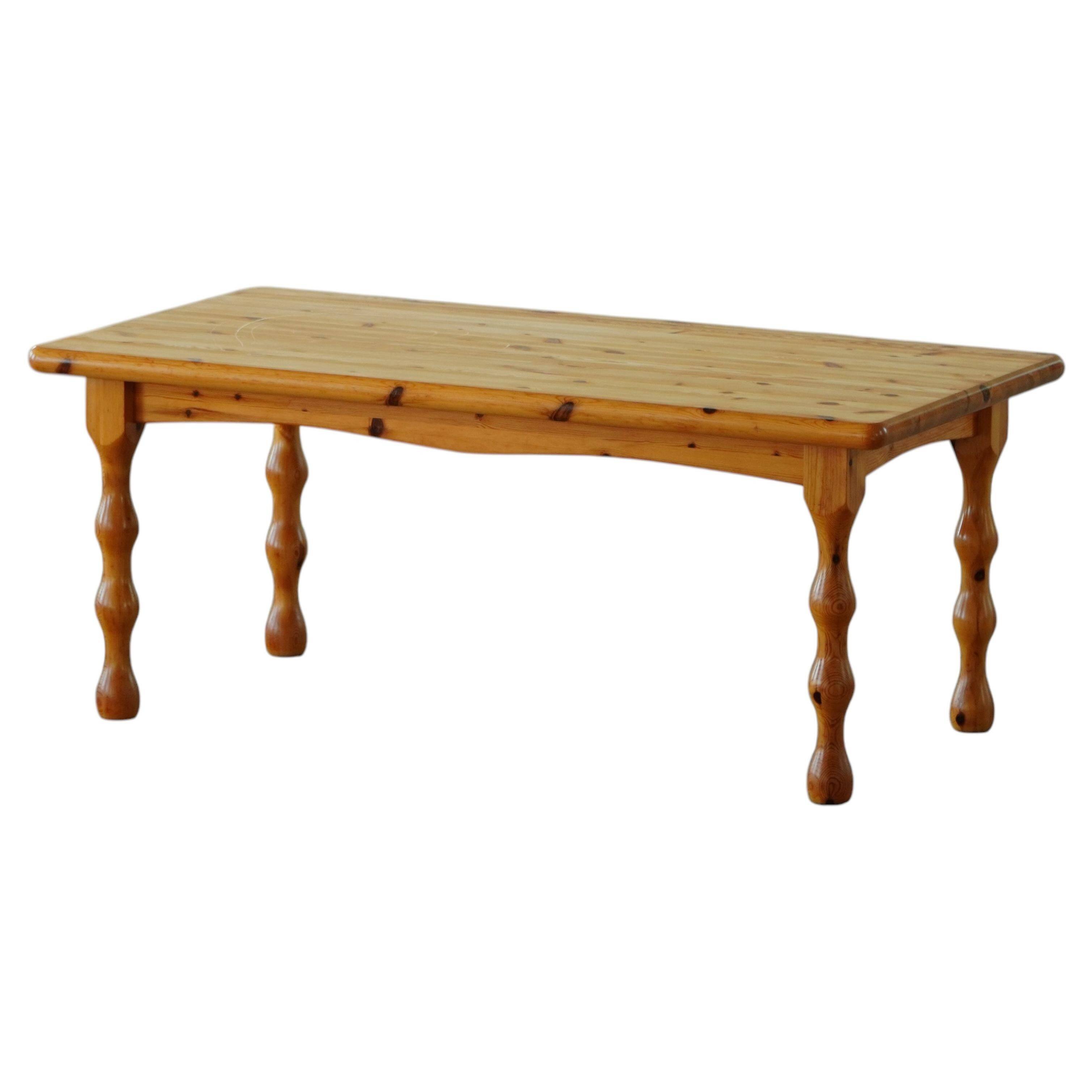 Scandinavian coffee table in brutalist style made of pine, with turned legs, Danish modern style, 1970s.