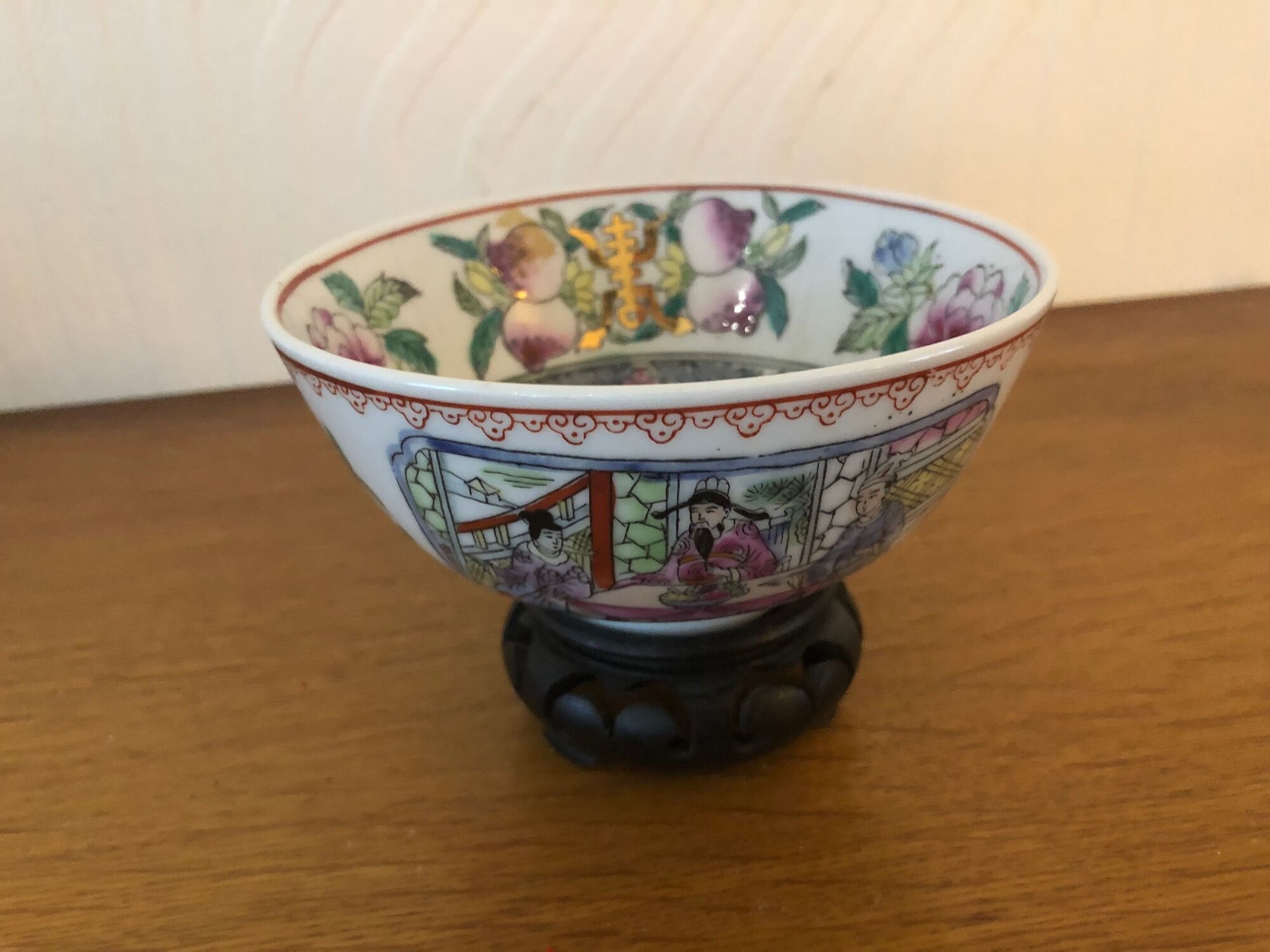 Chinese porcelain bowl on wooden base