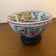 Chinese porcelain bowl on wooden base