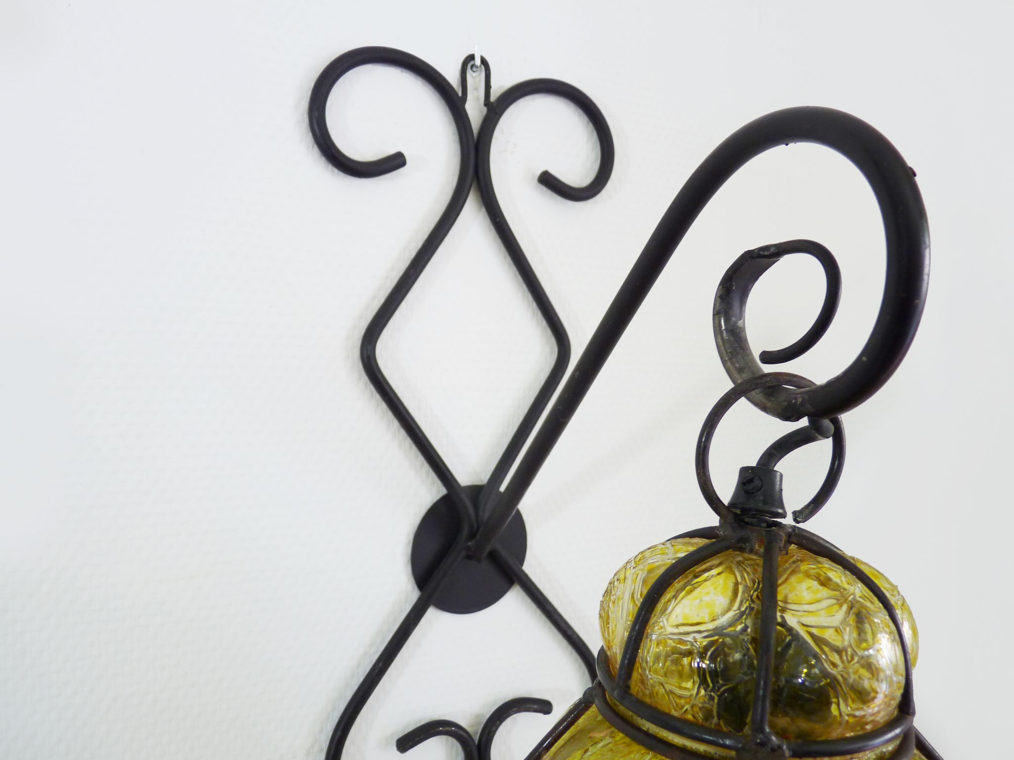 Italian vintage wall lamp in yellow blown glass and wrought iron. Year 70 80