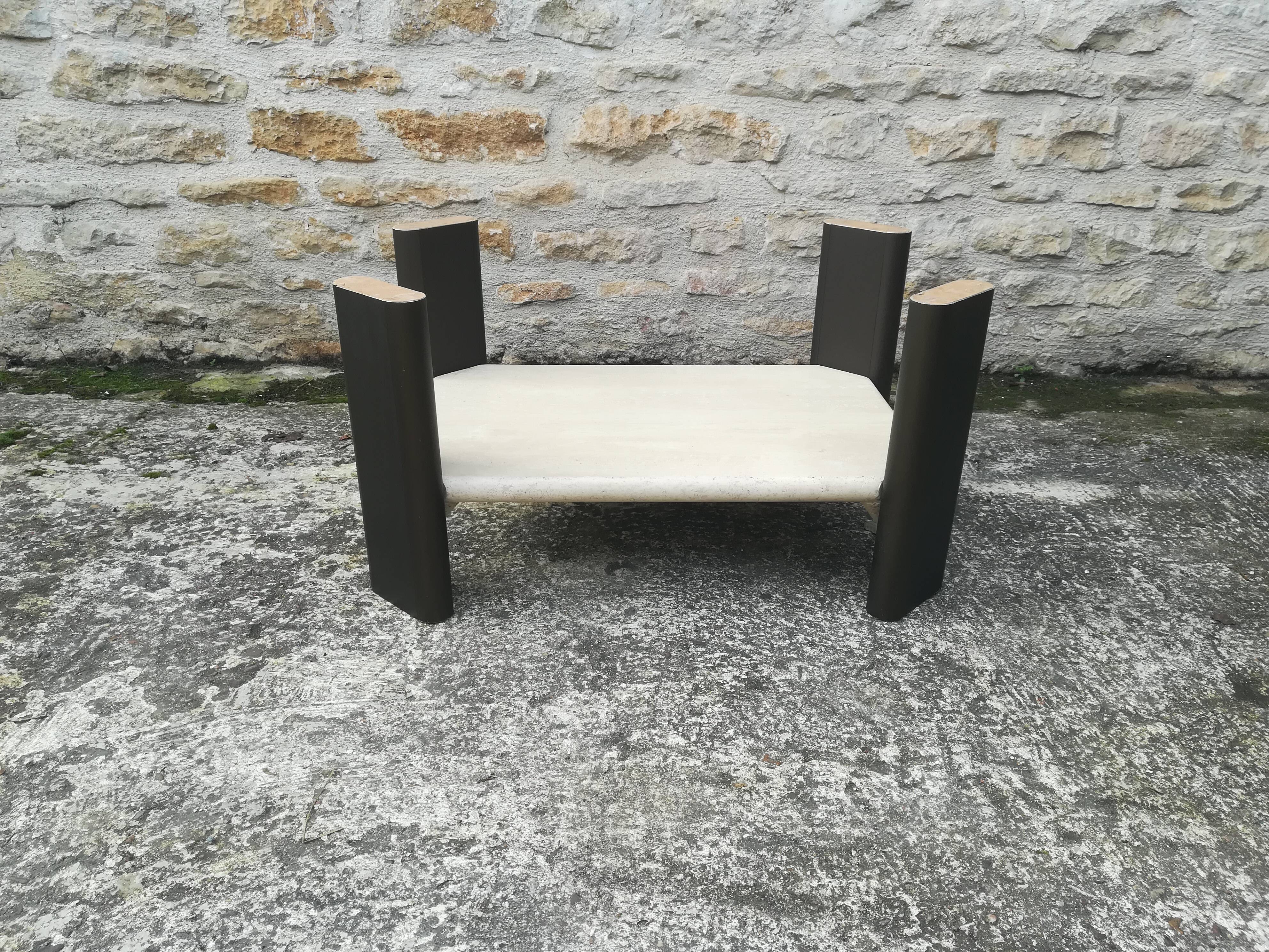 Low table in travertine and aluminium