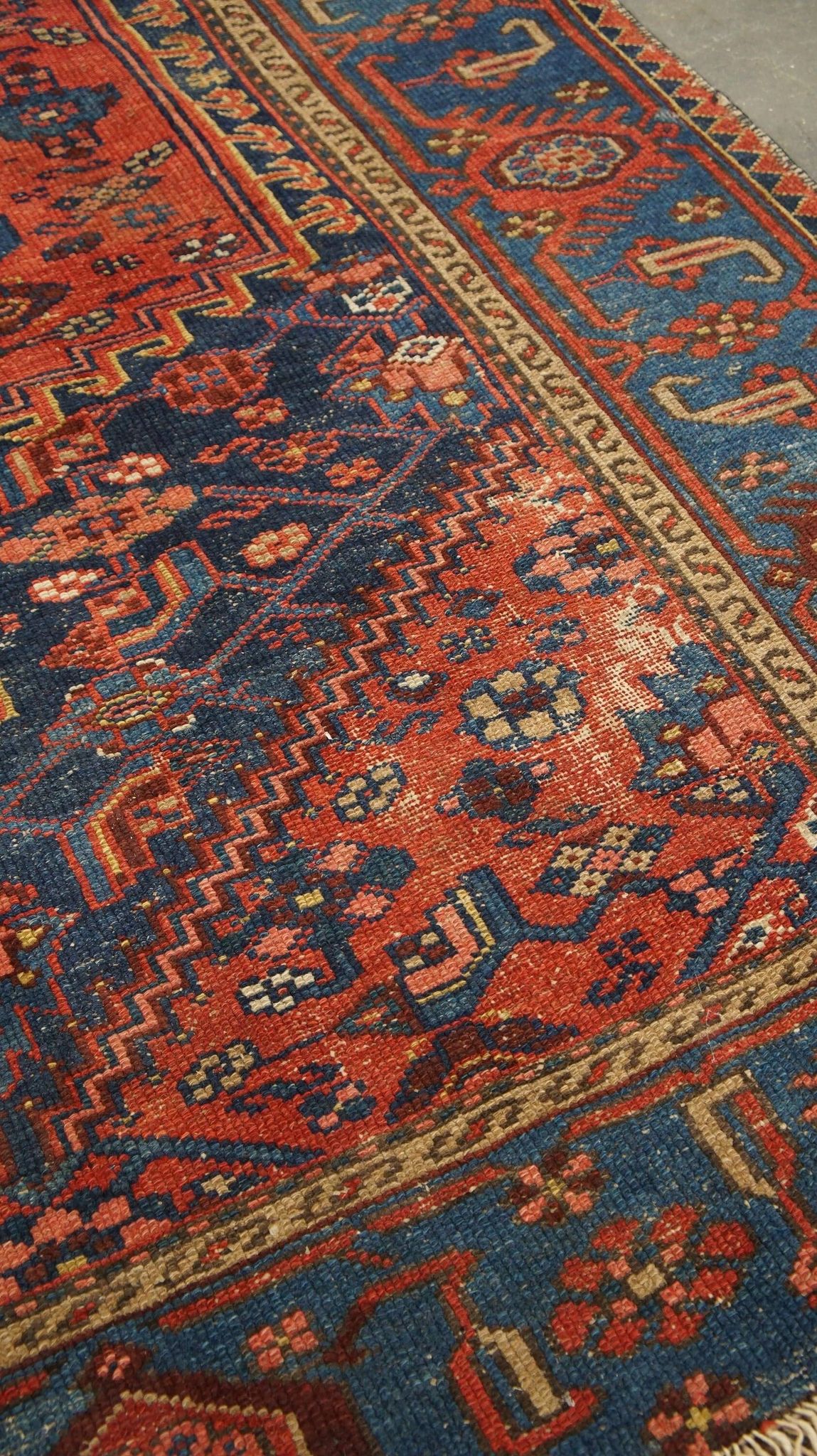 Antique hand-knotted oriental rug with predominantly red, purple, and blue colors 182x136cm