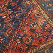 Antique hand-knotted oriental rug with predominantly red, purple, and blue colors 182x136cm