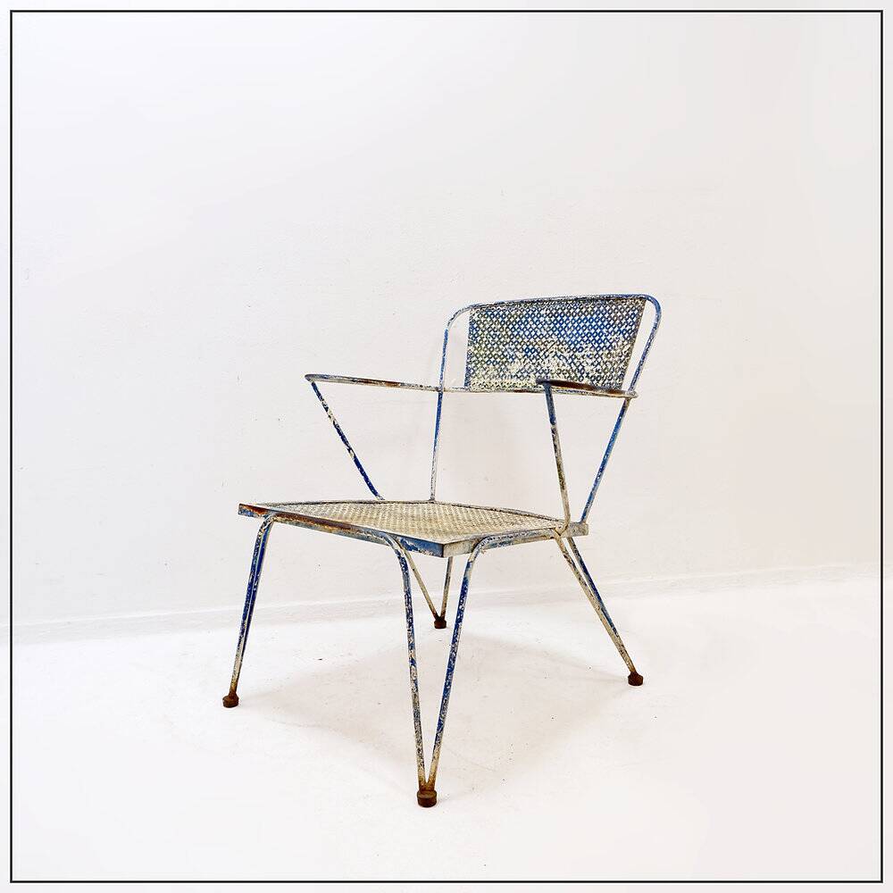 Vintage perforated metal armchair from the 1950s.