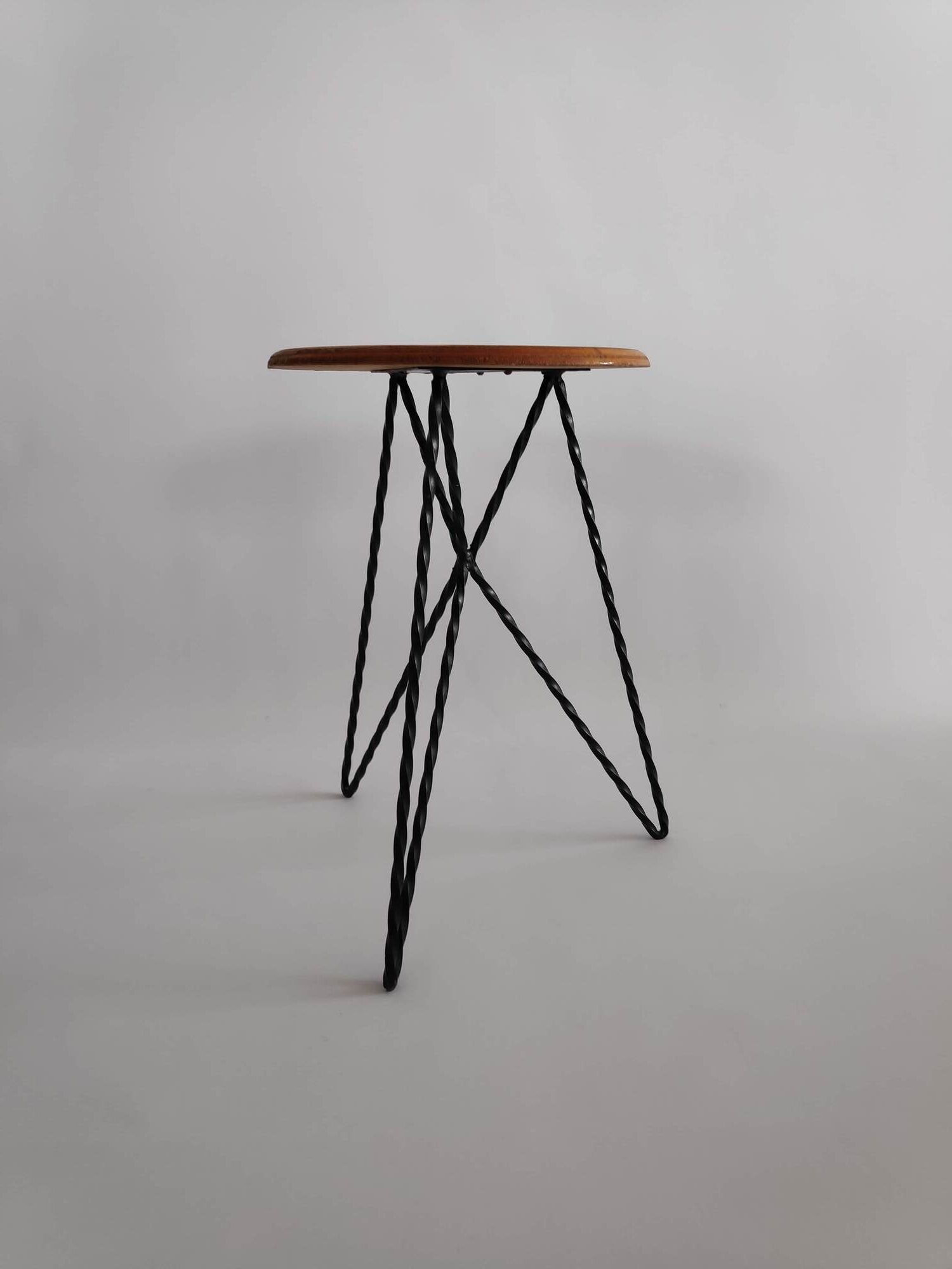 Vintage stool in wood and twisted metal of the years 60