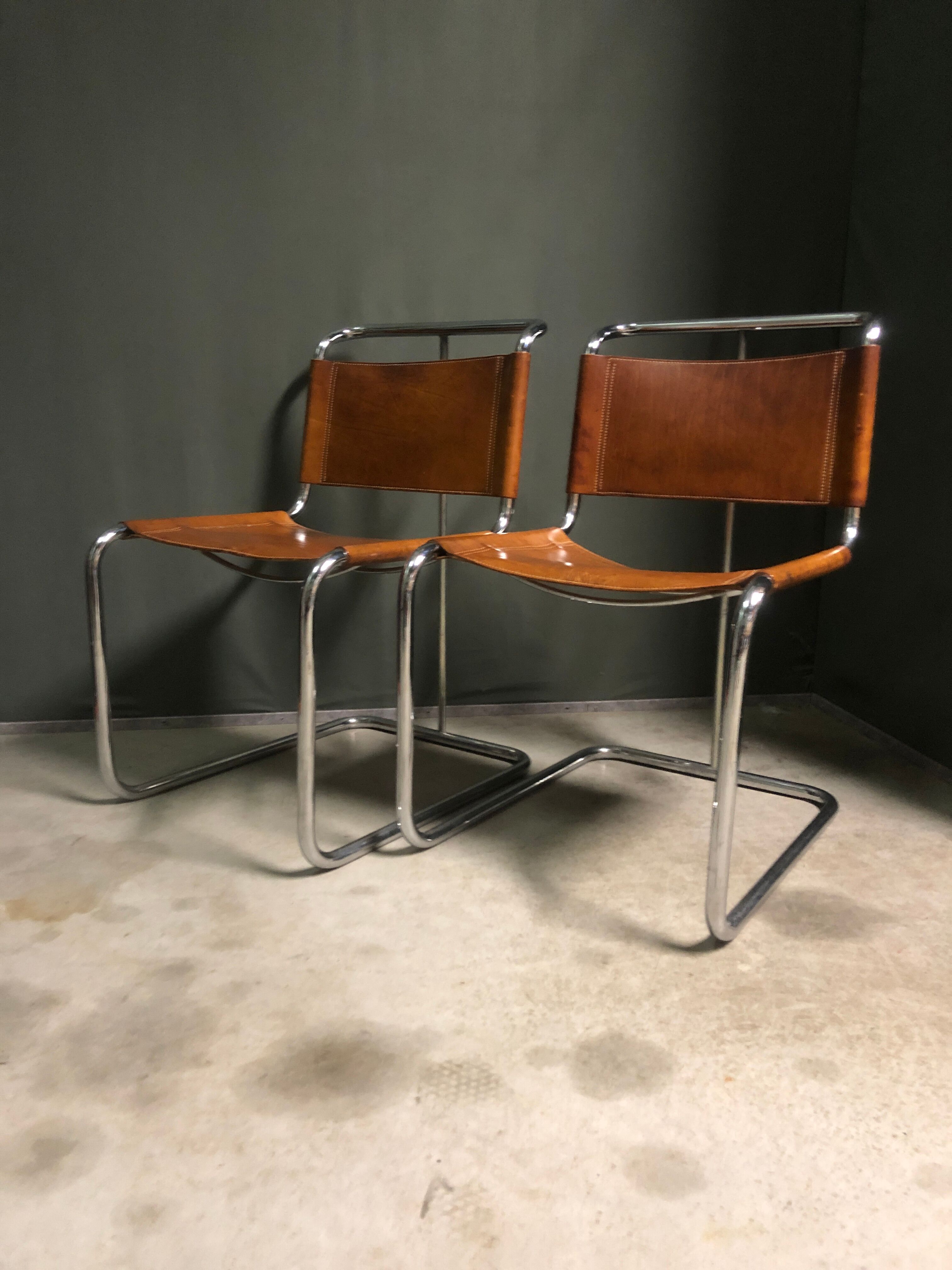 A pair of chromed tubular dining chairs 1980's