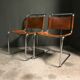 A pair of chromed tubular dining chairs 1980's