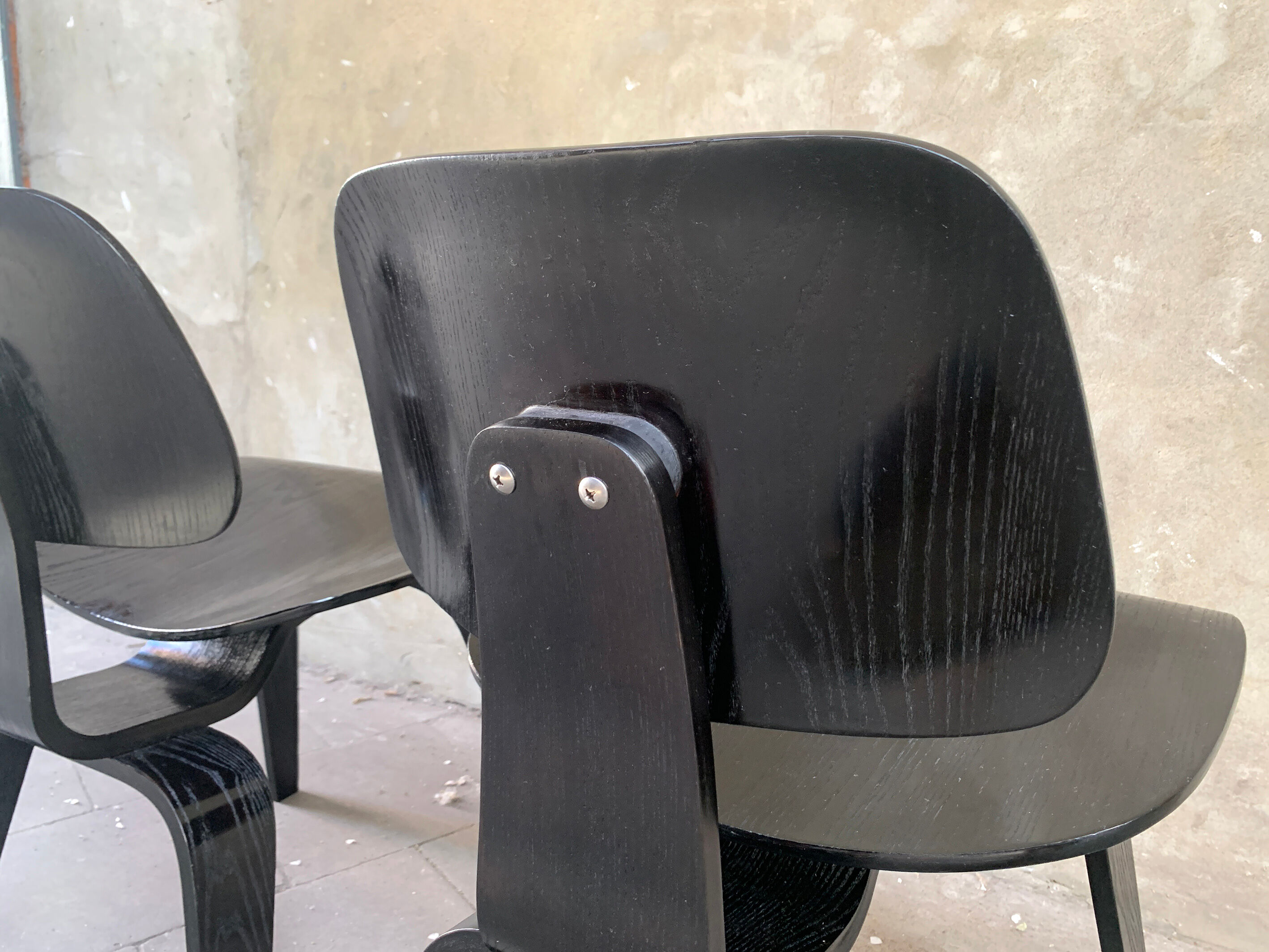 Pair of DCW chairs by Charles & Ray Eames in Black for Herman Miller 1950