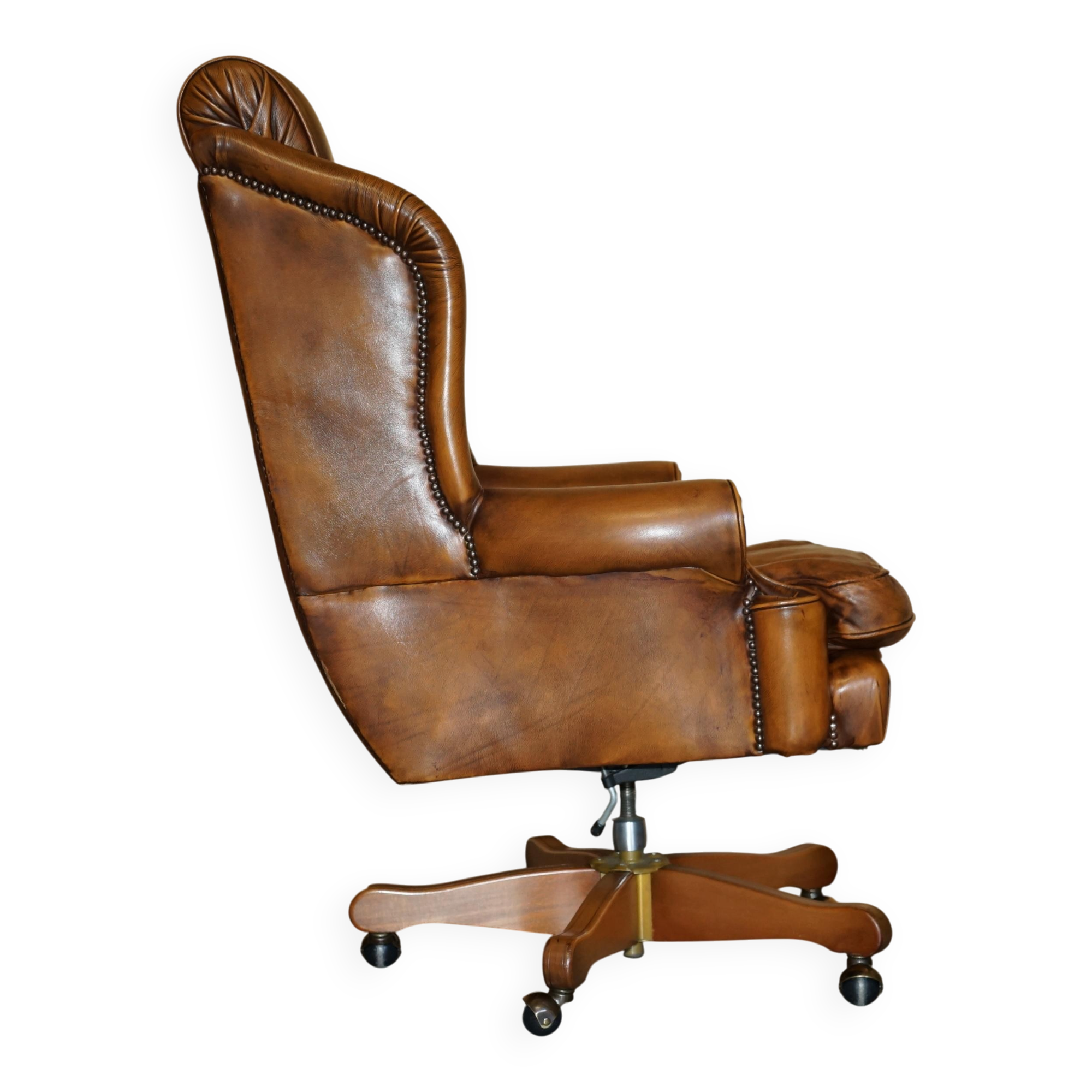 Captain's chair Chesterfield vintage leather with tufted wingback.