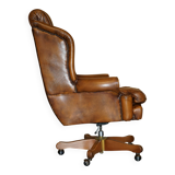 Captain's chair Chesterfield vintage leather with tufted wingback.