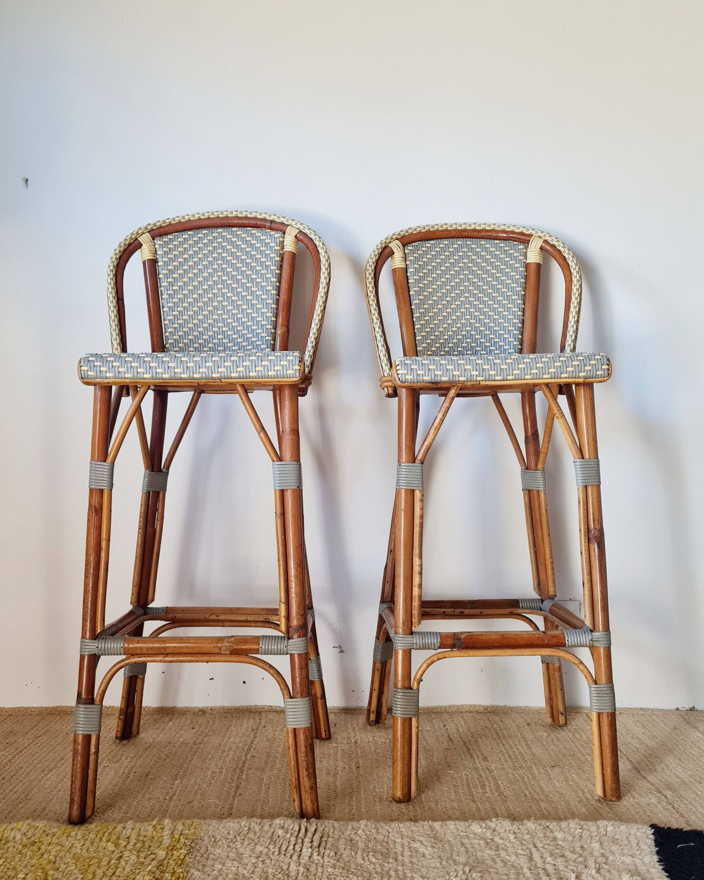 Vintage Gaty bar stools in two-tone rattan and cane.