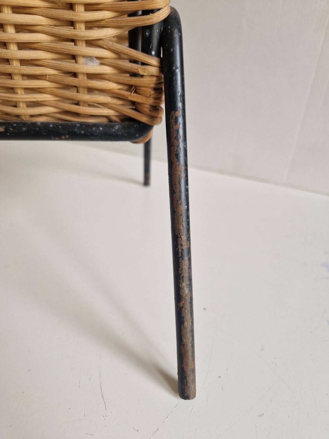 Raoul Guys magazine rack 1950s  
Rattan and black metal