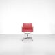 "EA 108" armchair in red leather, designed by Charles and Ray Eames for Vitra,