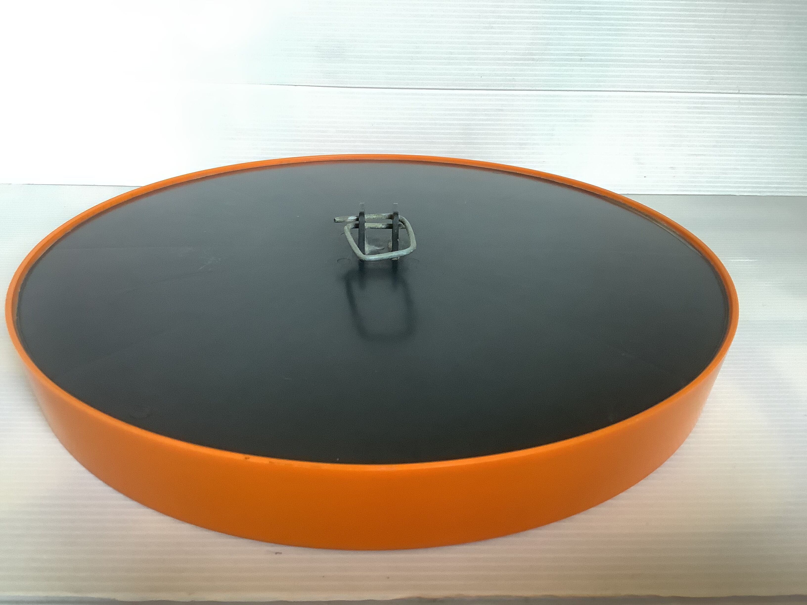 Old vintage orange round mirror