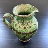 Old pitcher with ethnic decor