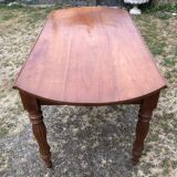 Louis Philippe oval shuttered table in solid cherry wood with 2 drawers.