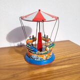 Old tin carousel toy
