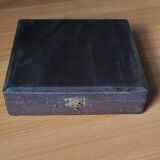 Many silver-plated metal teaspoons.