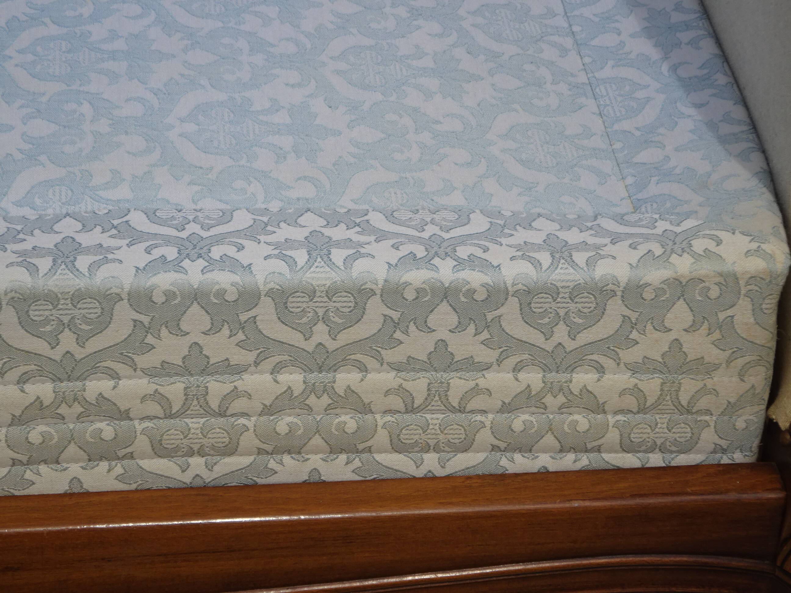 Solid wood bed frame with Jacquard fabric.