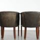 Set of two cowhide and wooden tub chairs with a sturdy colour scheme