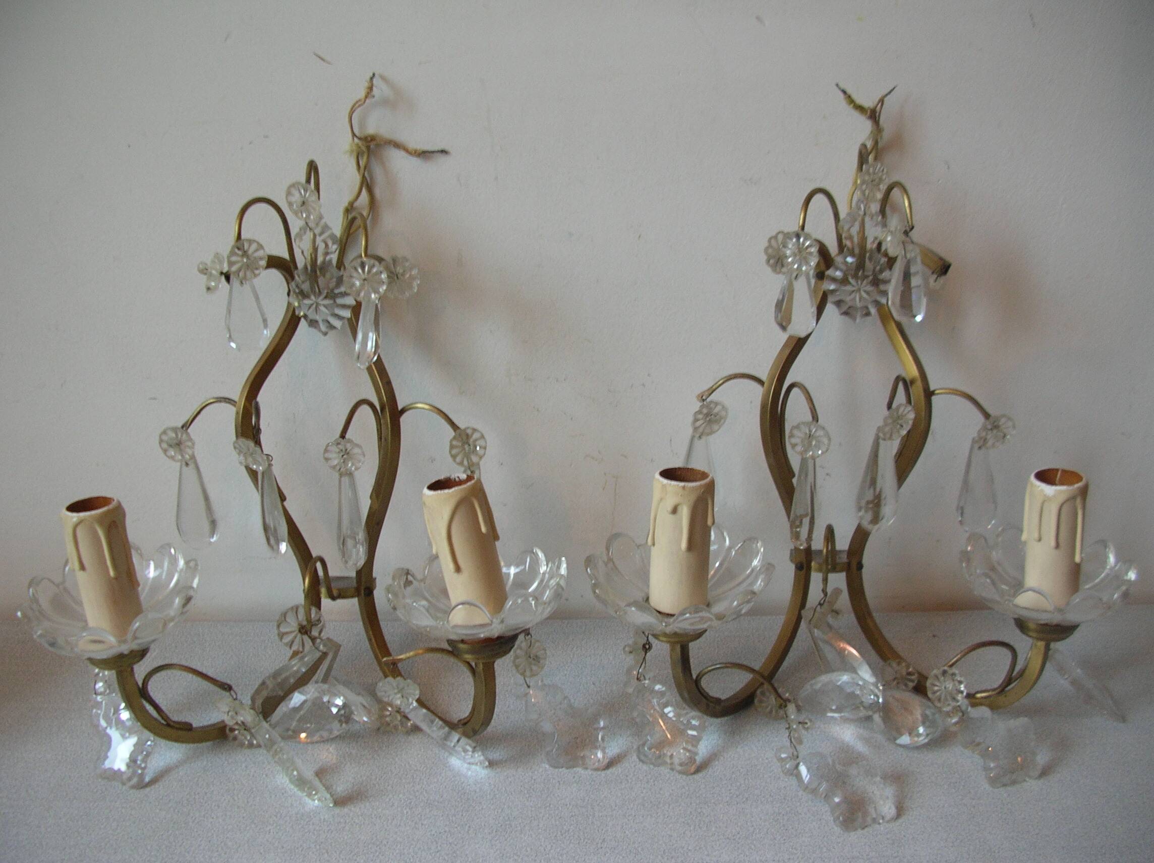 Old pair of double lamp lights with glass and brass pendants, retro decoration