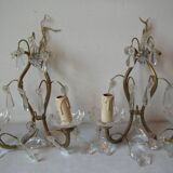 Old pair of double lamp lights with glass and brass pendants, retro decoration