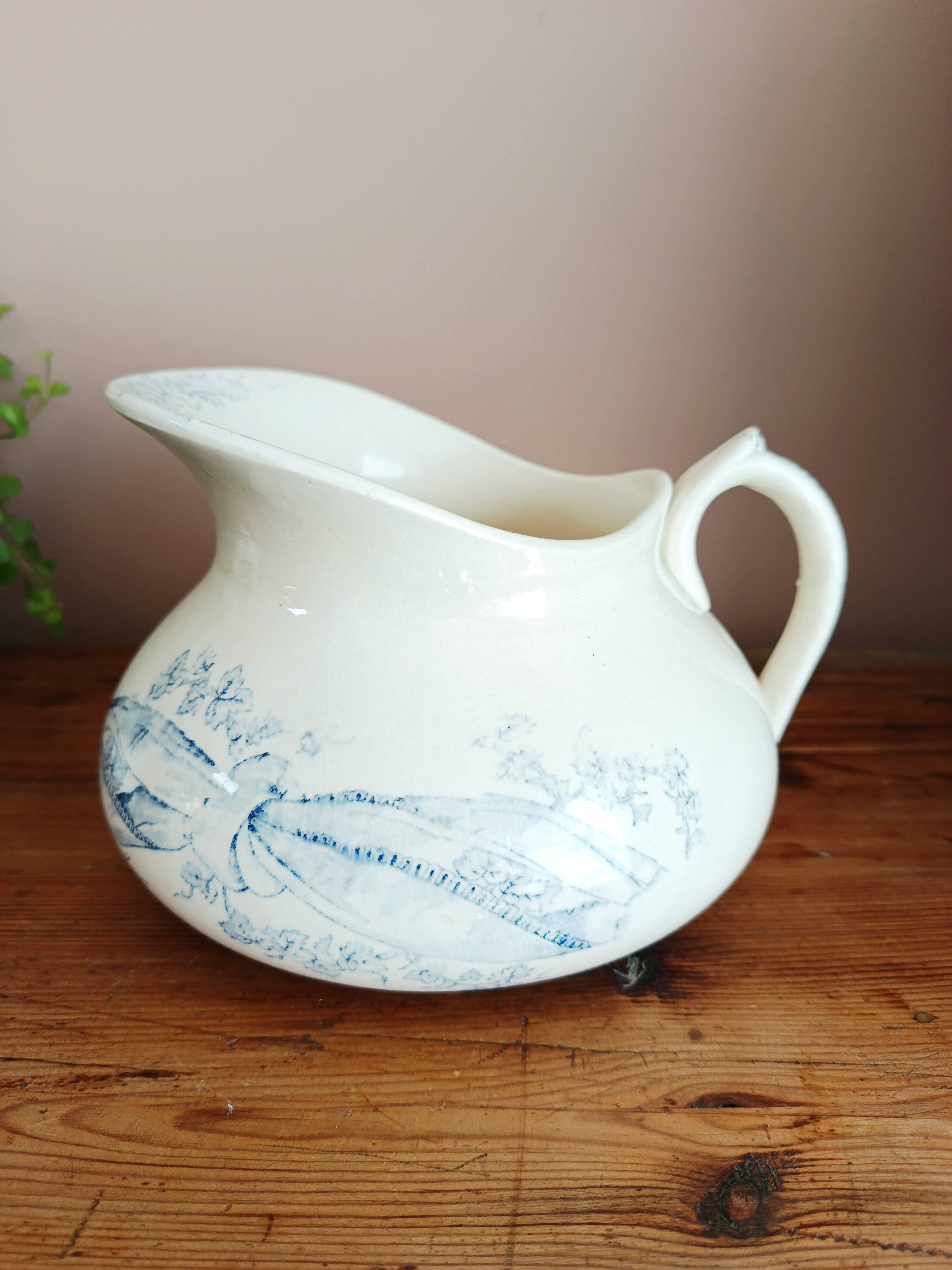 Old bulbous jug in ironstone earthenware