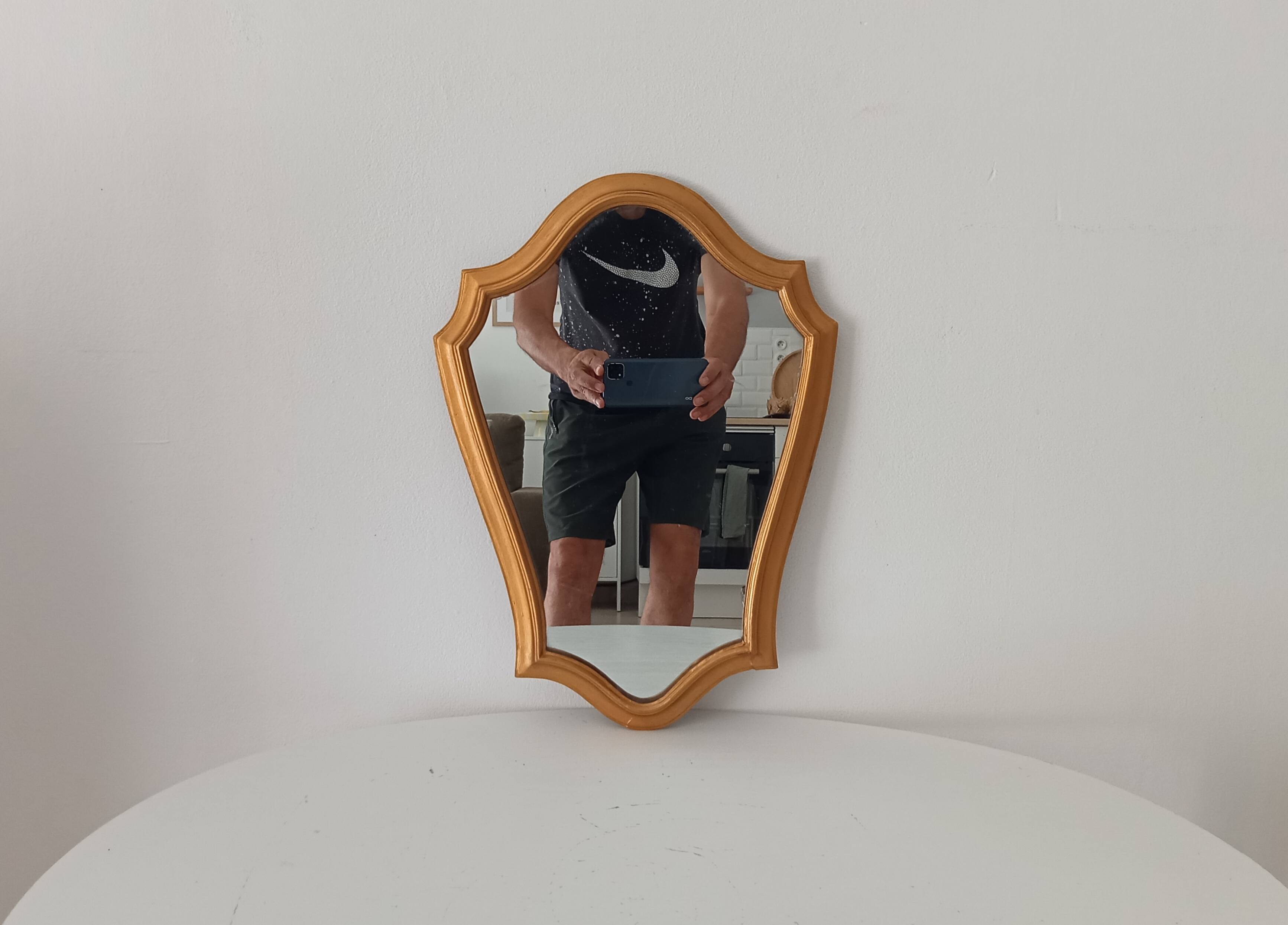 Vintage baroque mirror in gilded wood