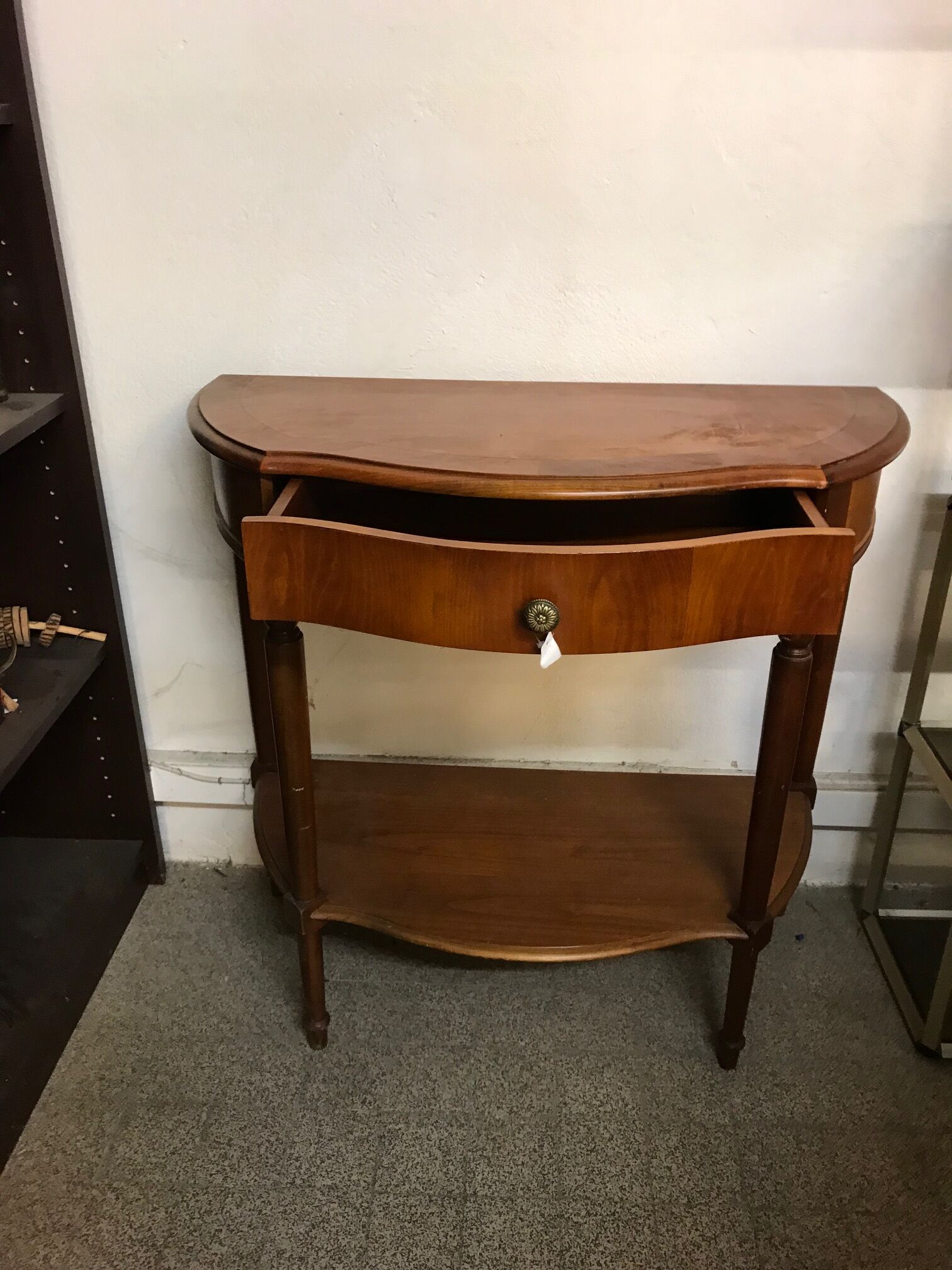 Cherry half-moon console with drawer and bottom shelf