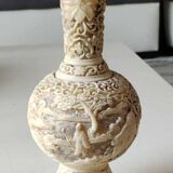 Asian-inspired ball vase. In beige cinnabar lacquer. Scenes of life decor. Arabesque and floral friezes. Height 24 cm