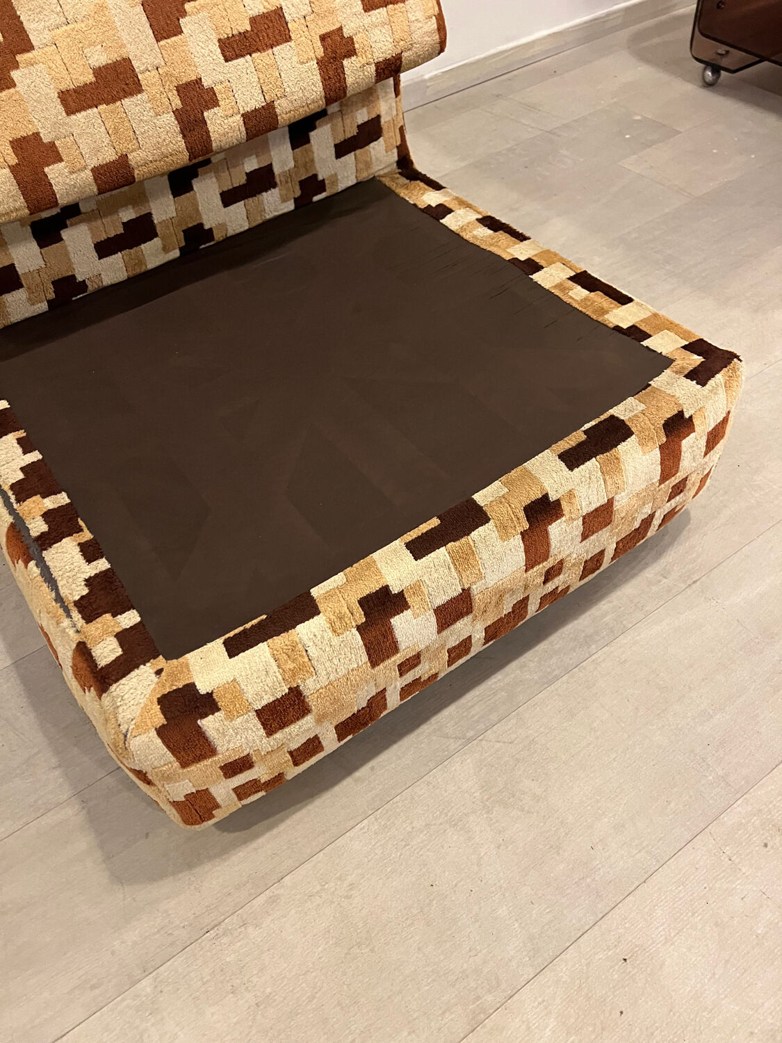 Vintage armchair from the 70s in beige and brown.