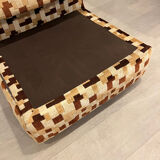 Vintage armchair from the 70s in beige and brown.