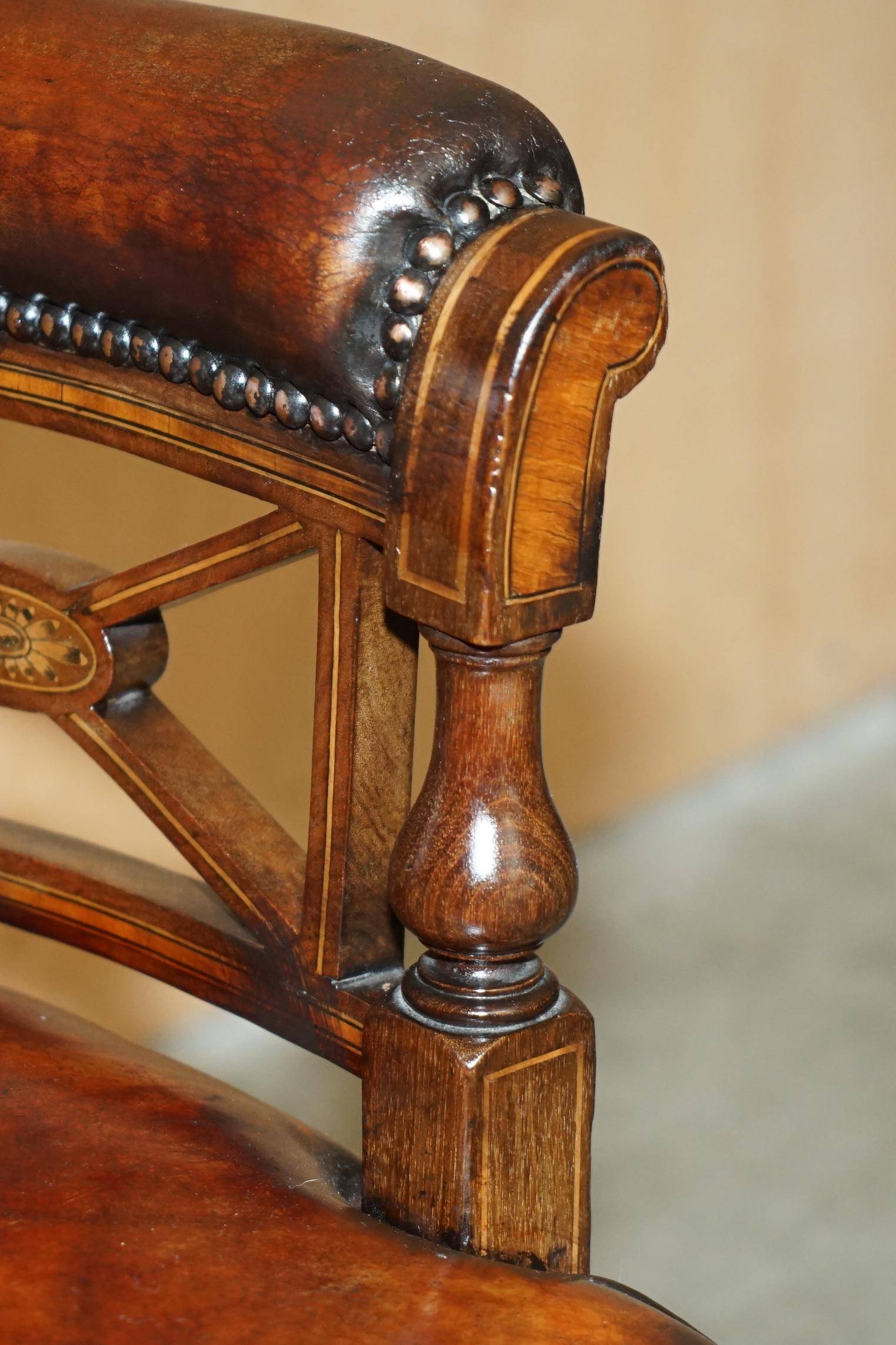 Victorian captain's chair in leather restored by Cornelius V Smith.