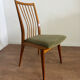 Scandinavian chairs with green velvet upholstery.