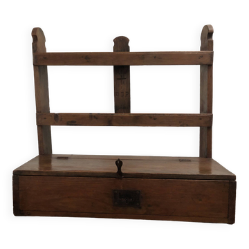 Antique wooden wall shelf that belonged to a clergyman.