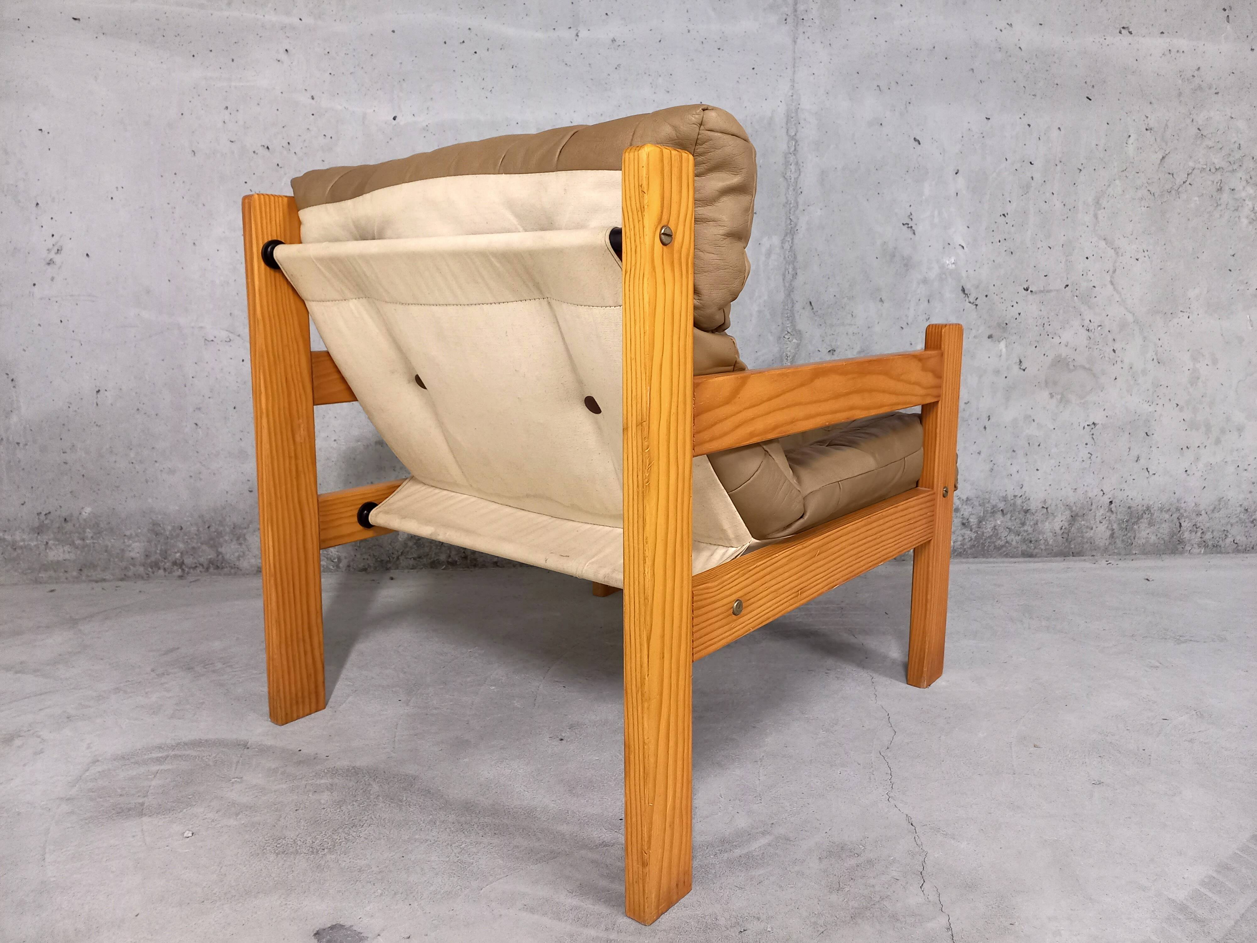Vintage heater armchair in pine and leather 70s
