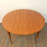 Round table with butterfly extension