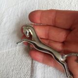 Un porte-couteau cheval métal argenté