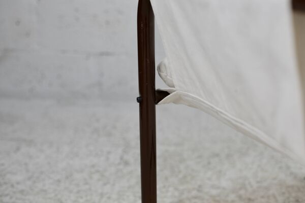 Fauteuil tubulaire, assise suspendue tissus. Circa 1970