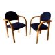 Set of two stackable beech chairs in curved Scandinavian style from IKEA.