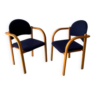 Set of two stackable beech chairs in curved Scandinavian style IKEA.