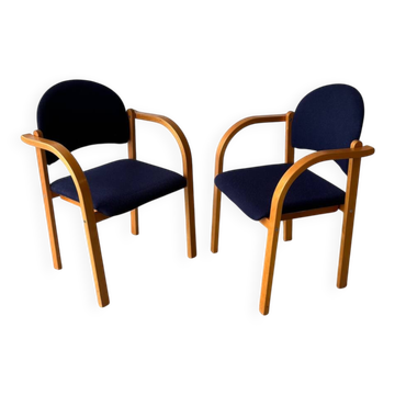 Set of two stackable beech chairs in curved Scandinavian style from IKEA.