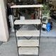Industrial-style shelf in light wood and cast iron