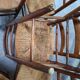 Set of six rustic chairs in natural wood with straw seats.