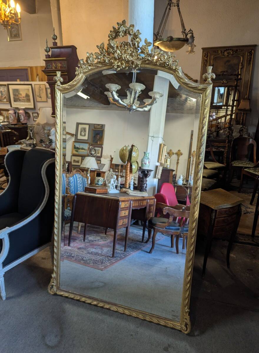 Very large Louis XVI style mirror in wood and gilded stucco with gold leaf