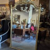Very large Louis XVI style mirror in wood and gilded stucco with gold leaf