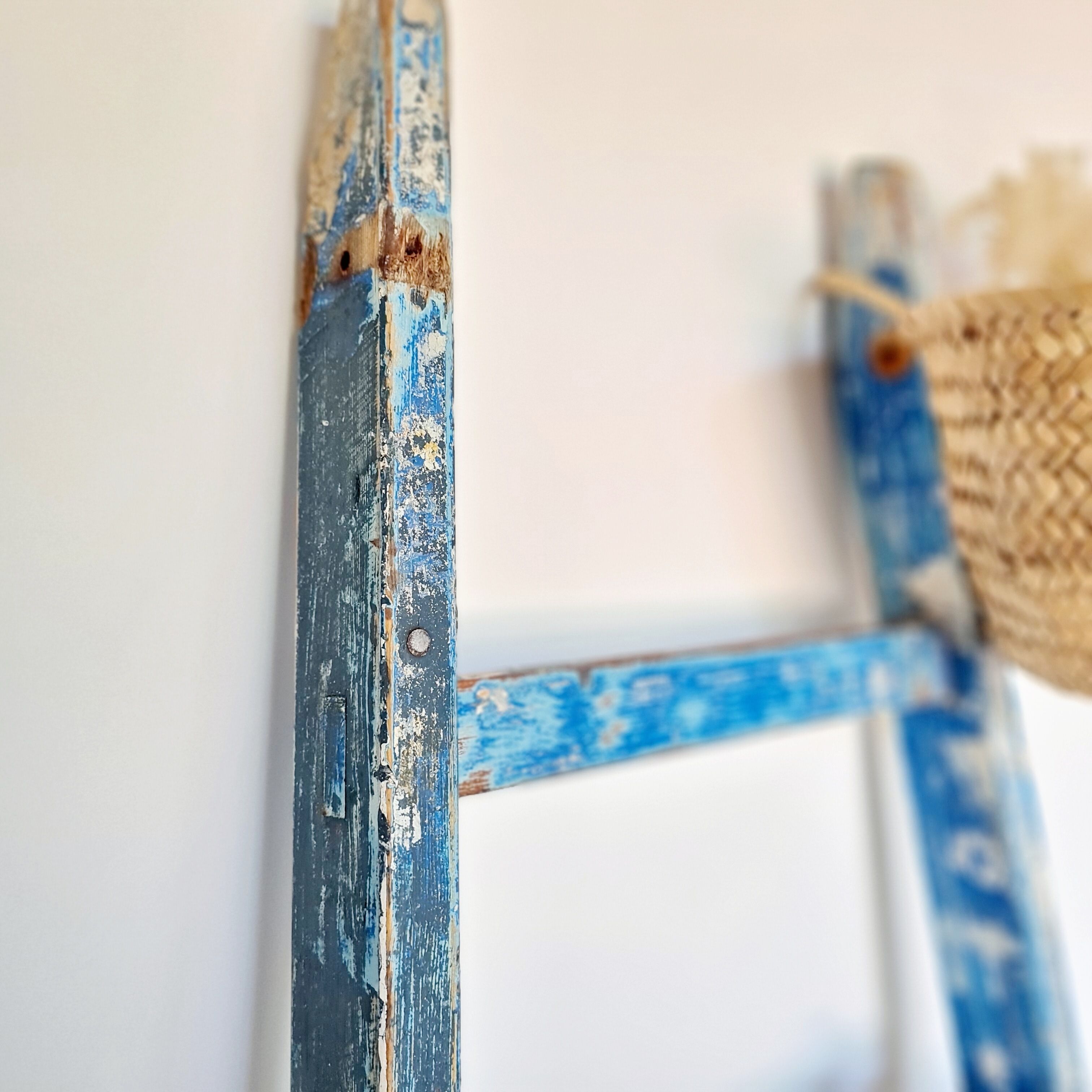 Old ladder in blue wood