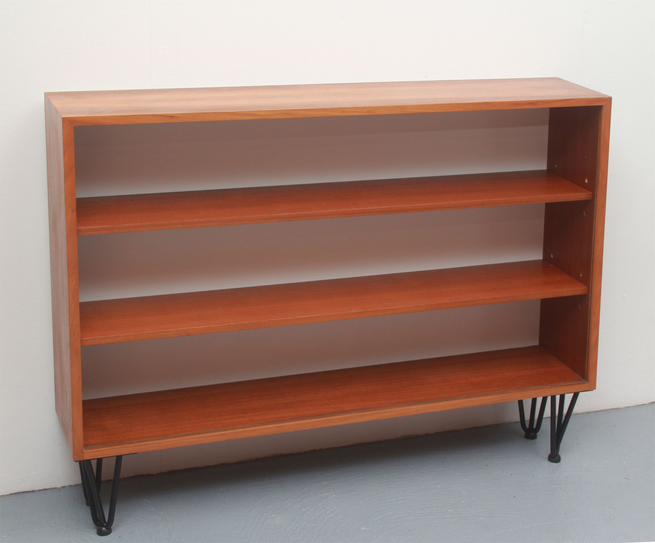1960s book shelf in walnut, white back panel